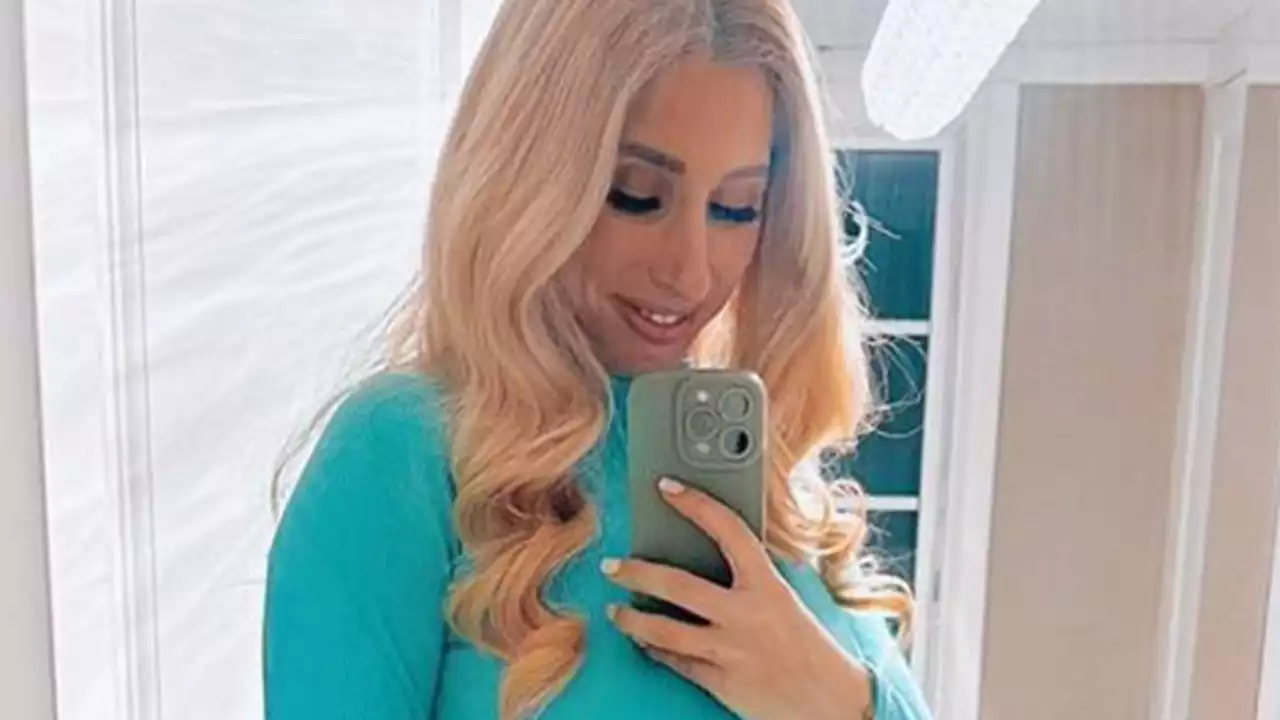 Pregnant Stacey Solomon shows off her huge baby bump in a tight blue dress