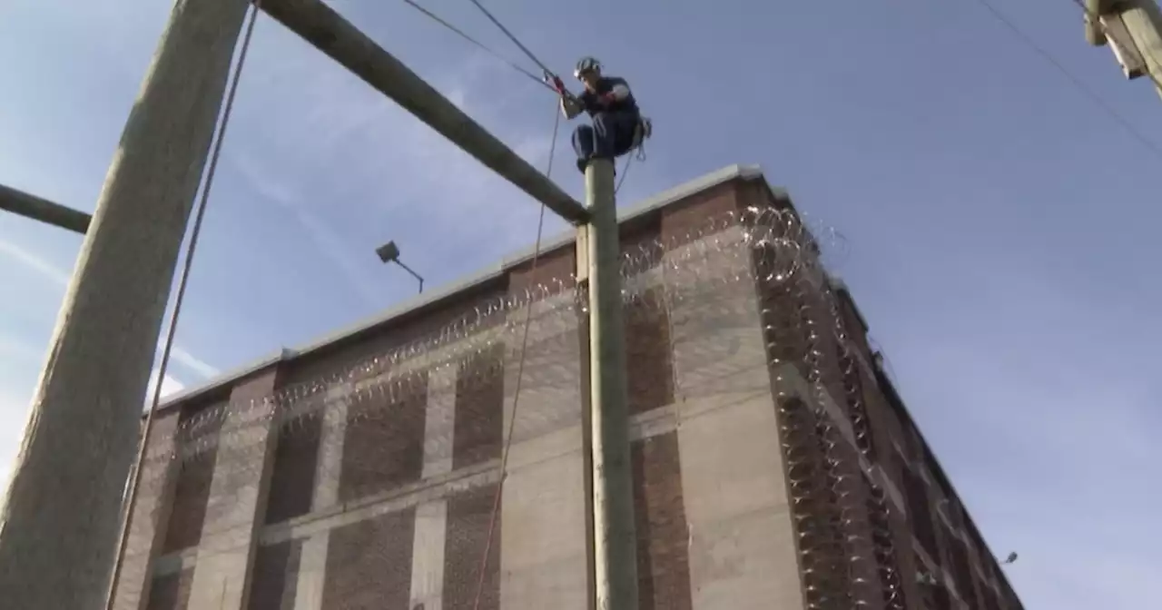 Michigan program trains prisoners to trim around power lines