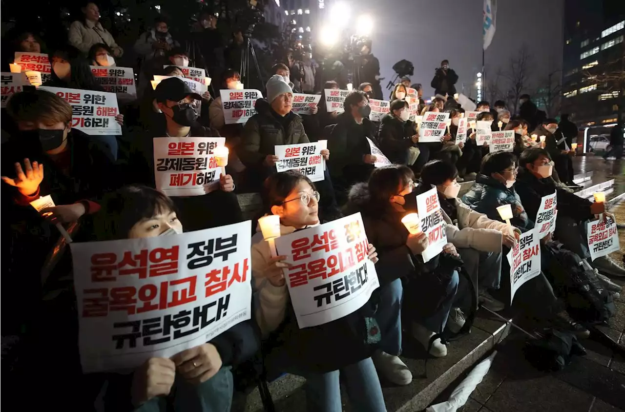 “일본 위한 굴욕적 강제동원 해법 폐기하라” 촛불 든 시민들