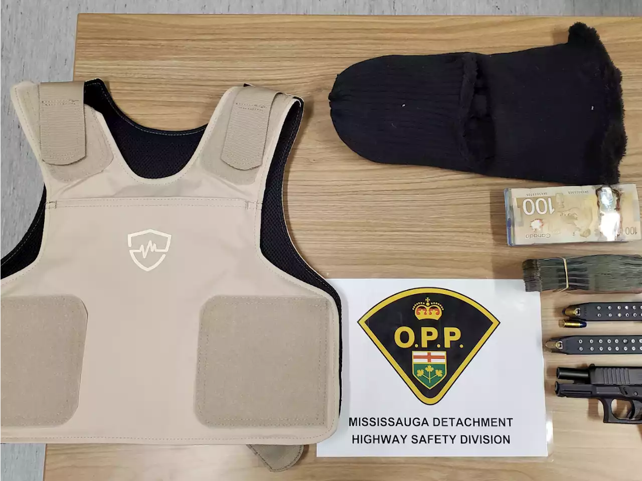 Two men allegedly caught in Mississauga with pistol, cash, body armour