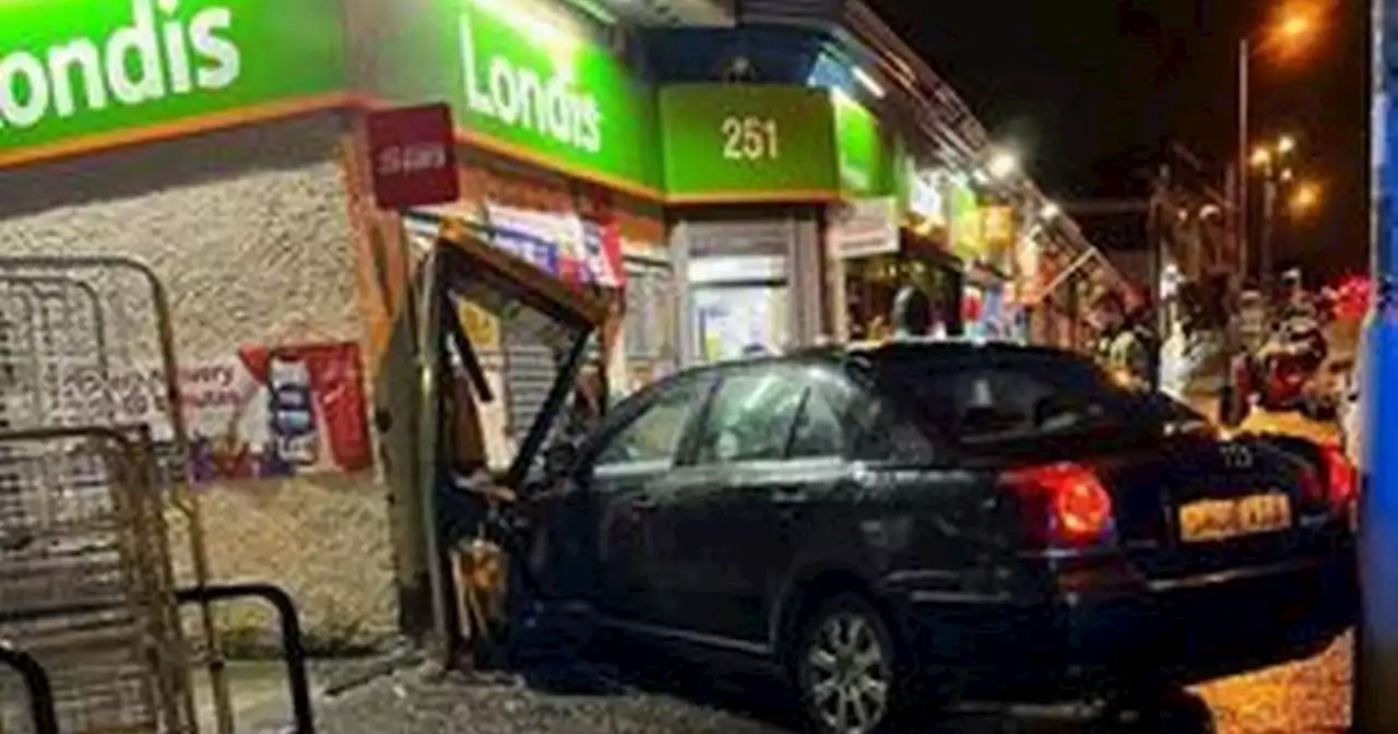 Car ploughs into shop after three-vehicle smash on busy Glasgow street