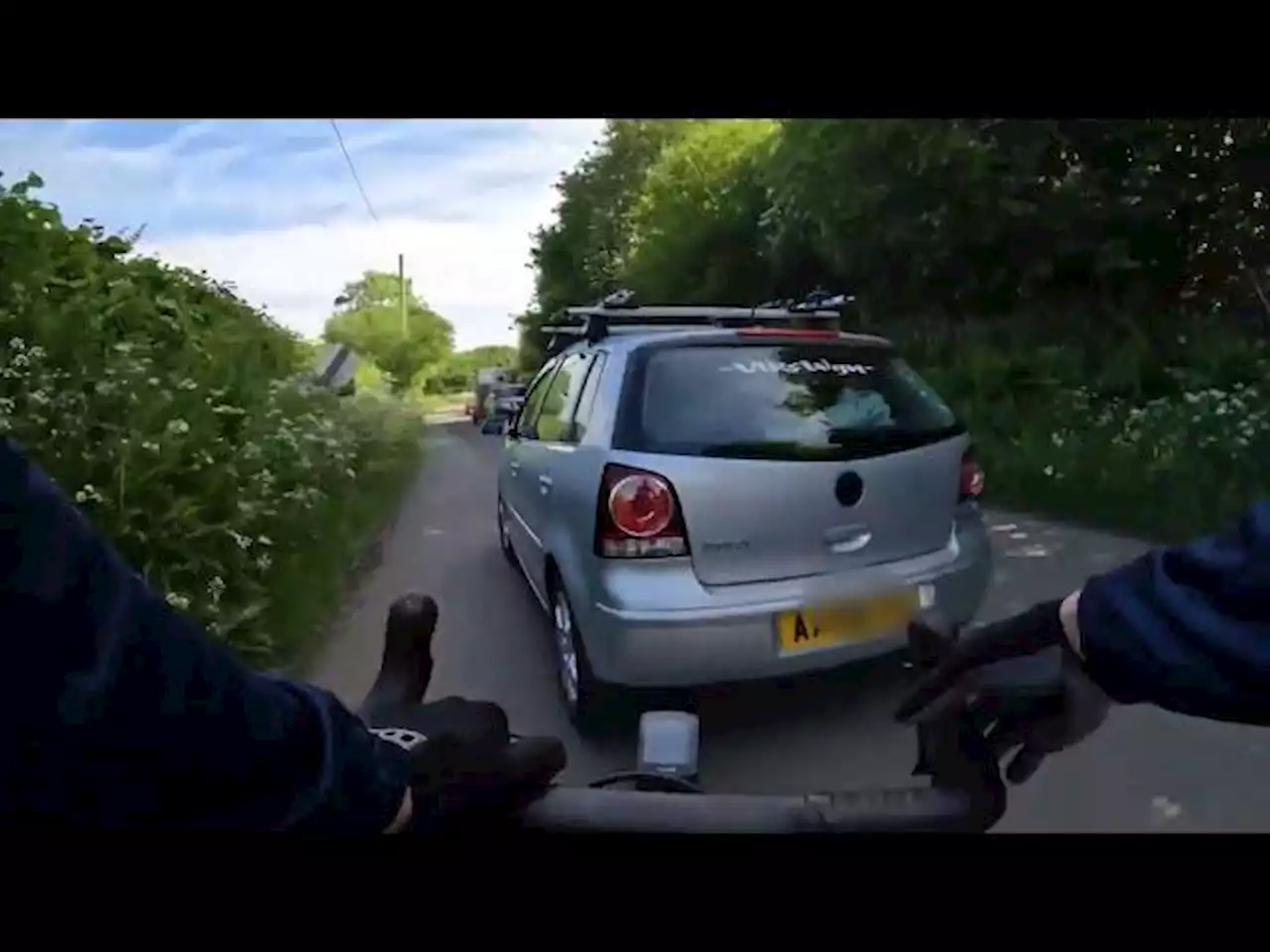 Near Miss of the Day 845: Cyclist close passed... by driver with bike racks on their car