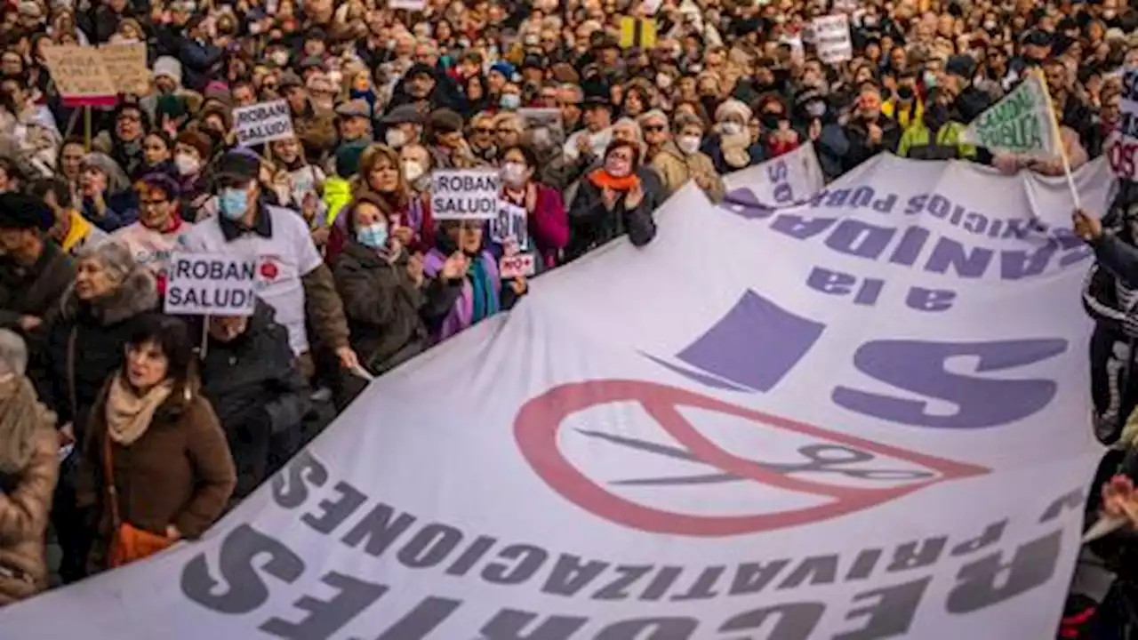 Tens of thousands march in Madrid to demand end to healthcare cuts