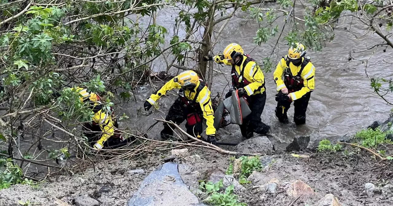 Orange County firefighters rescue woman trapped in rushing flood waters