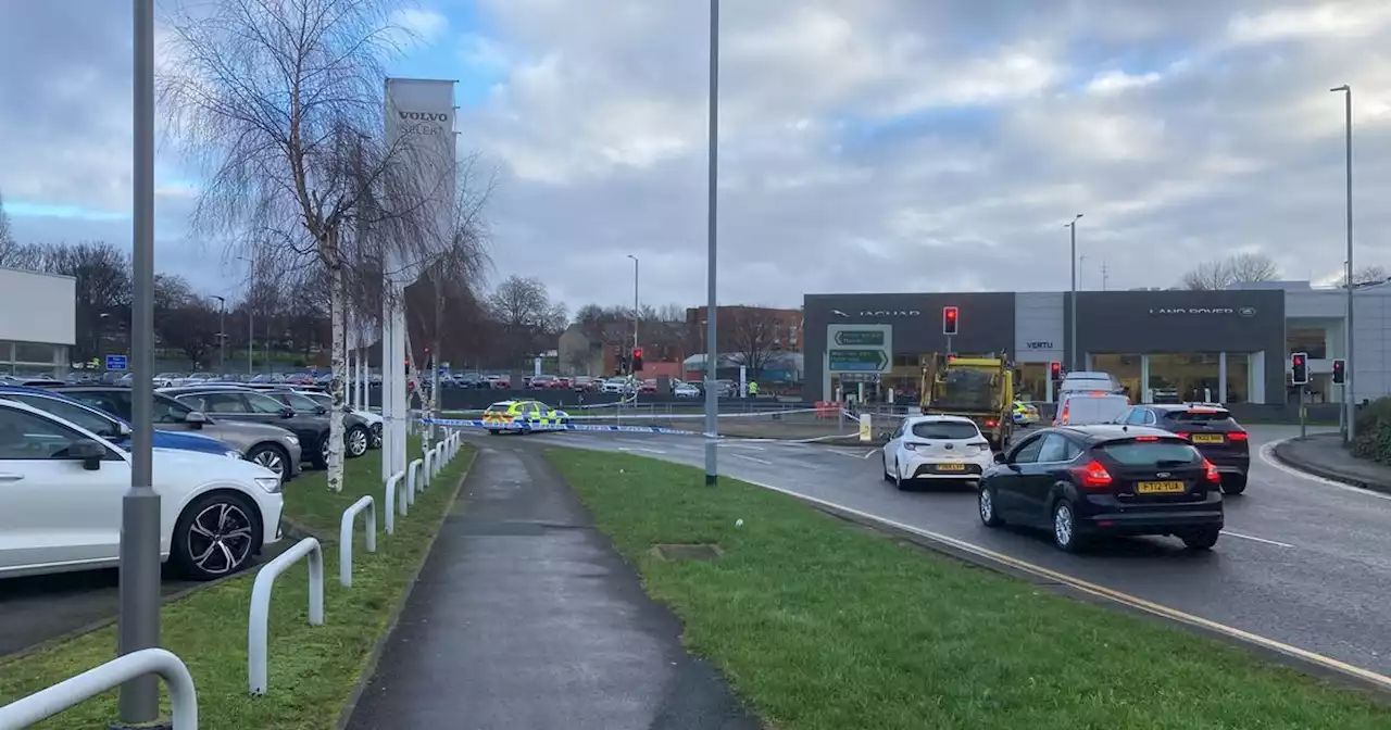 Multiple people rushed to hospital as car crashes into Jaguar garage