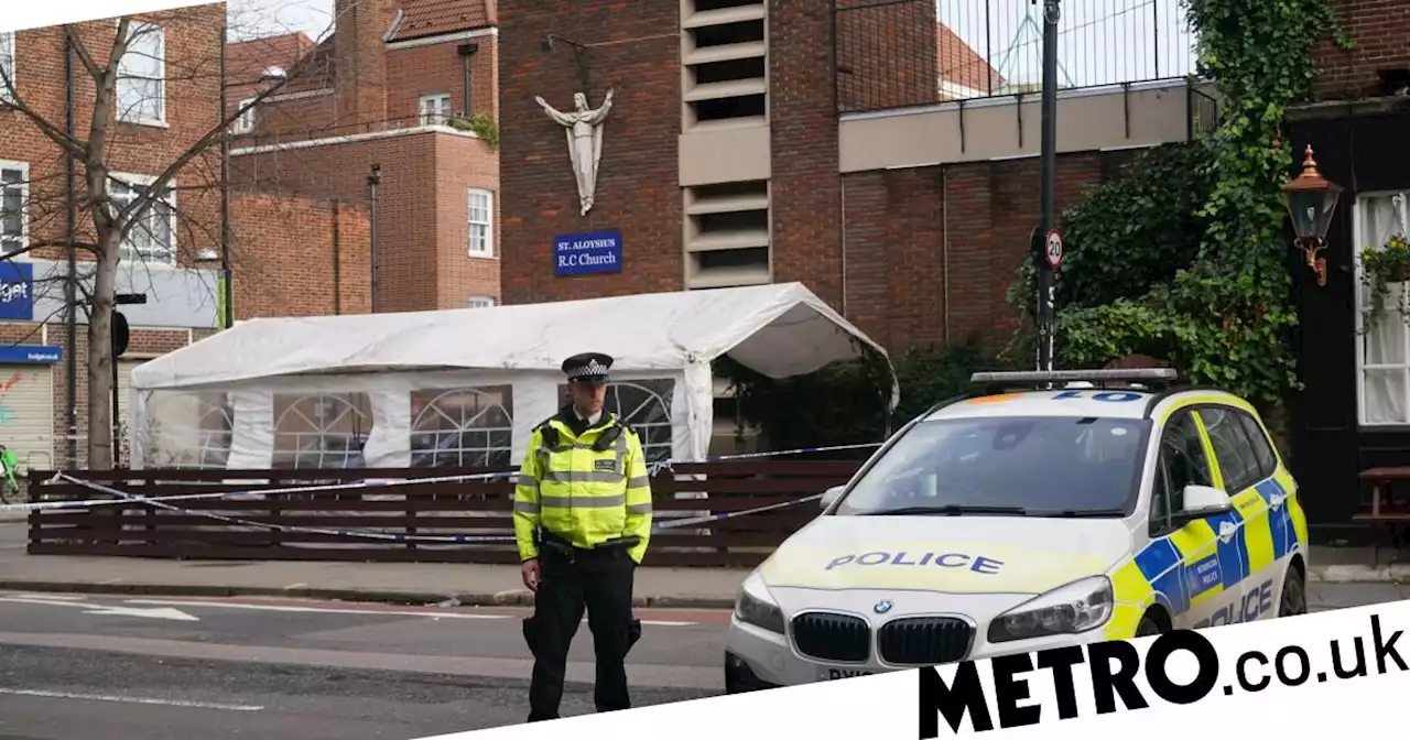 Man arrested on suspicion of murder after three shot in church drive-by attack