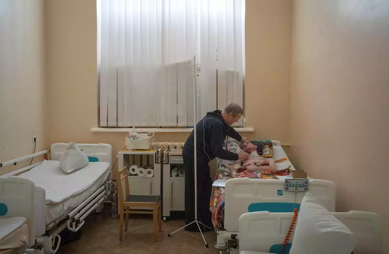 A Loving Dad and His Injured Son Pay War's Costs in Ukraine