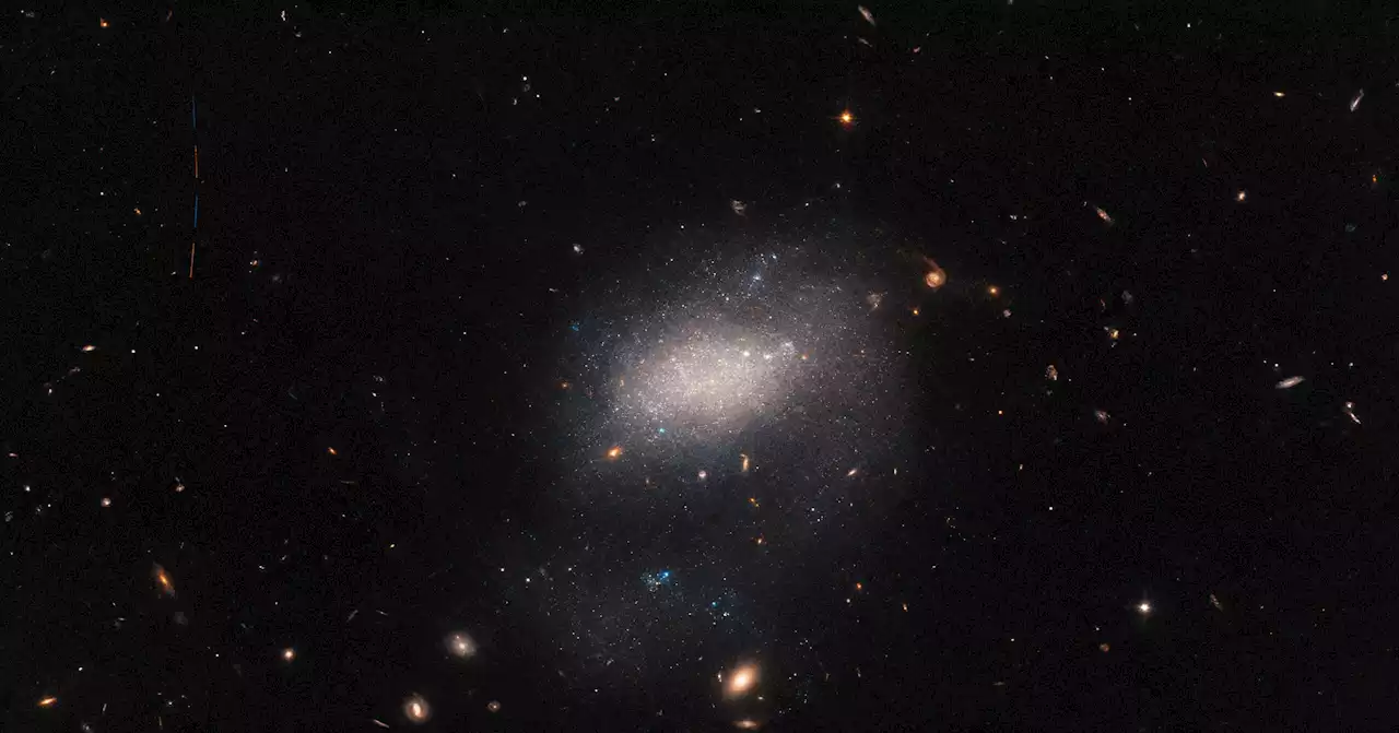 Hubble Spots an Astronomical Intruder in a Distant Galaxy