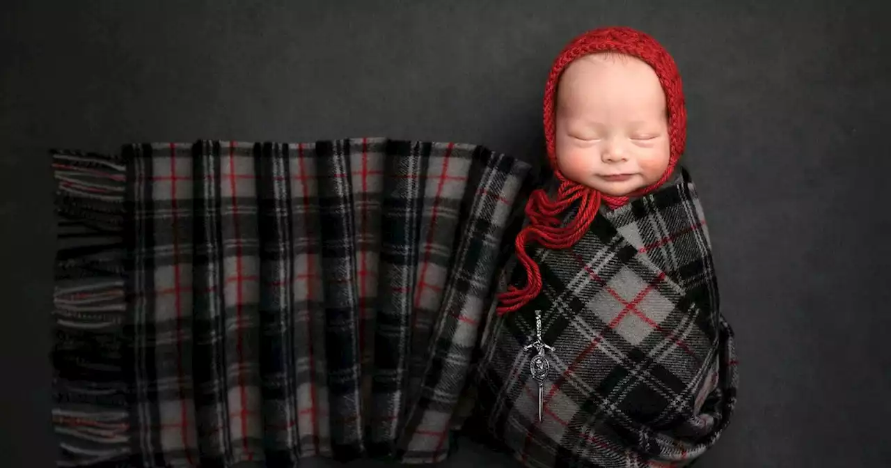 The first baby born in Scotland in 2023 snapped while swaddled in clan tartan