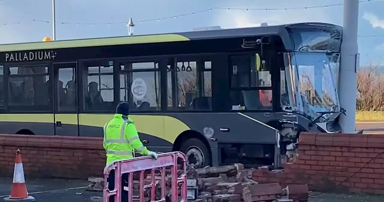 Bus driver hospitalised and five passengers treated after crash outside hotel