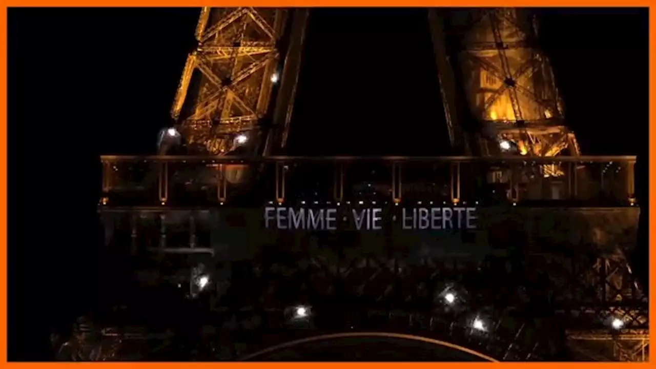 Paris' Eiffel Tower lights up with slogans in solidarity with Iranians