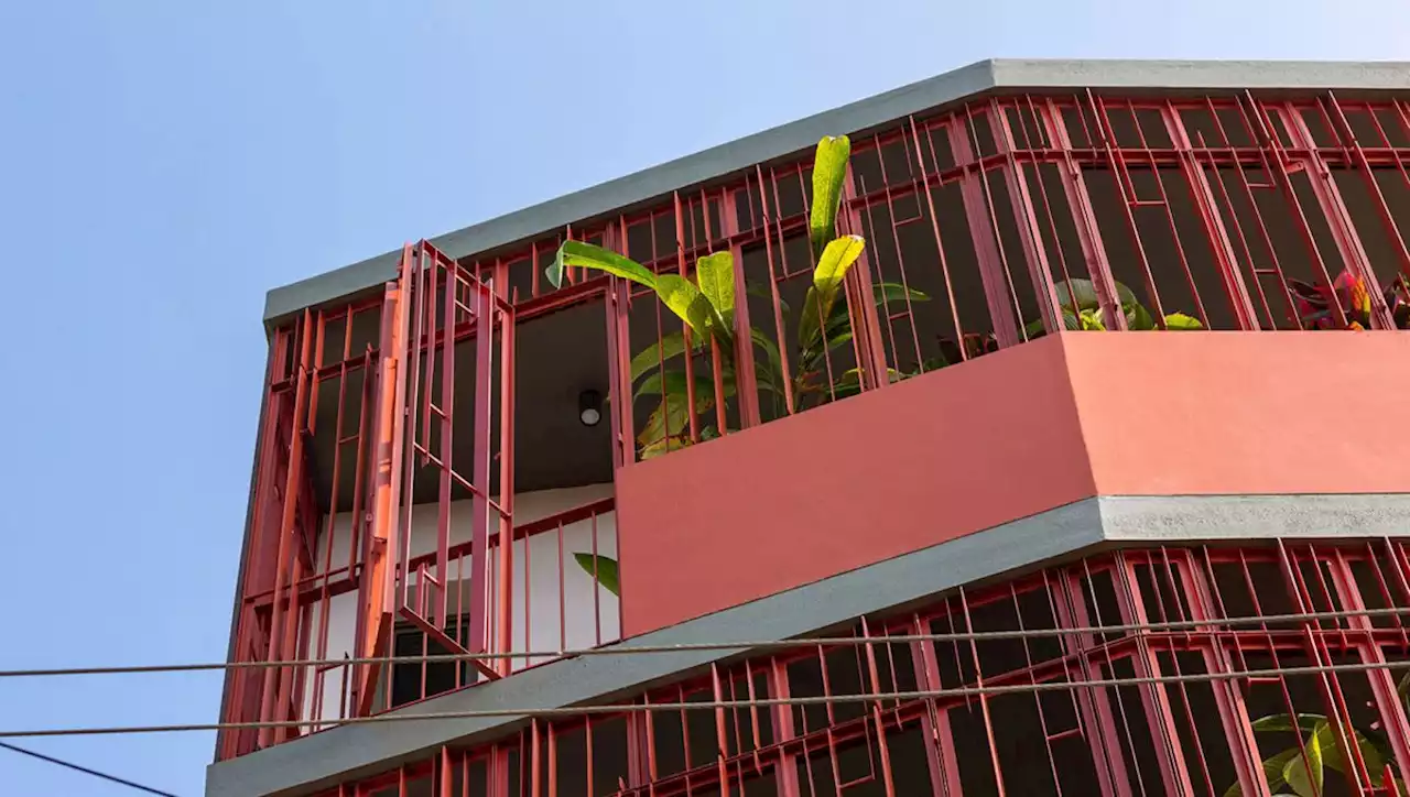 A minimalist Bengaluru home behind a red terracotta screen