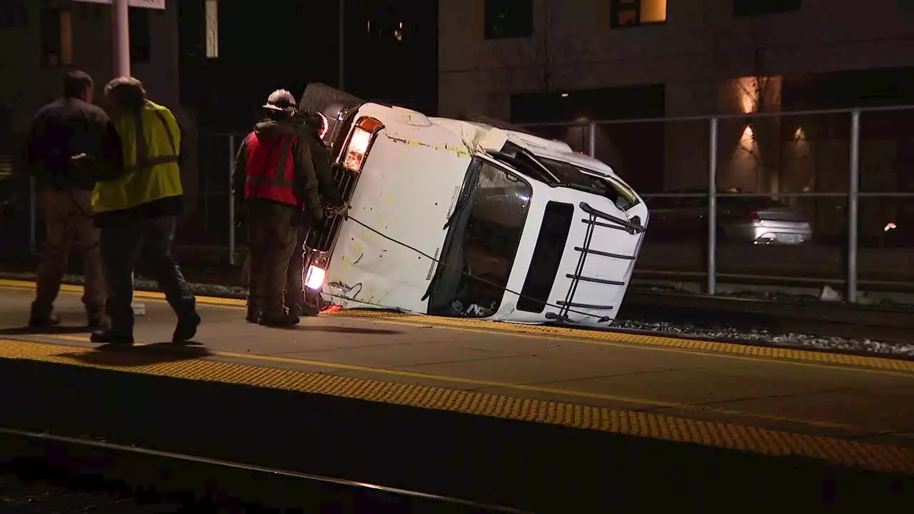 Car flips on Oakland train tracks