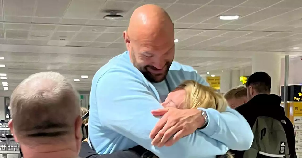 Tyson Fury embraces wife Paris as family land in UK after Tenerife holiday