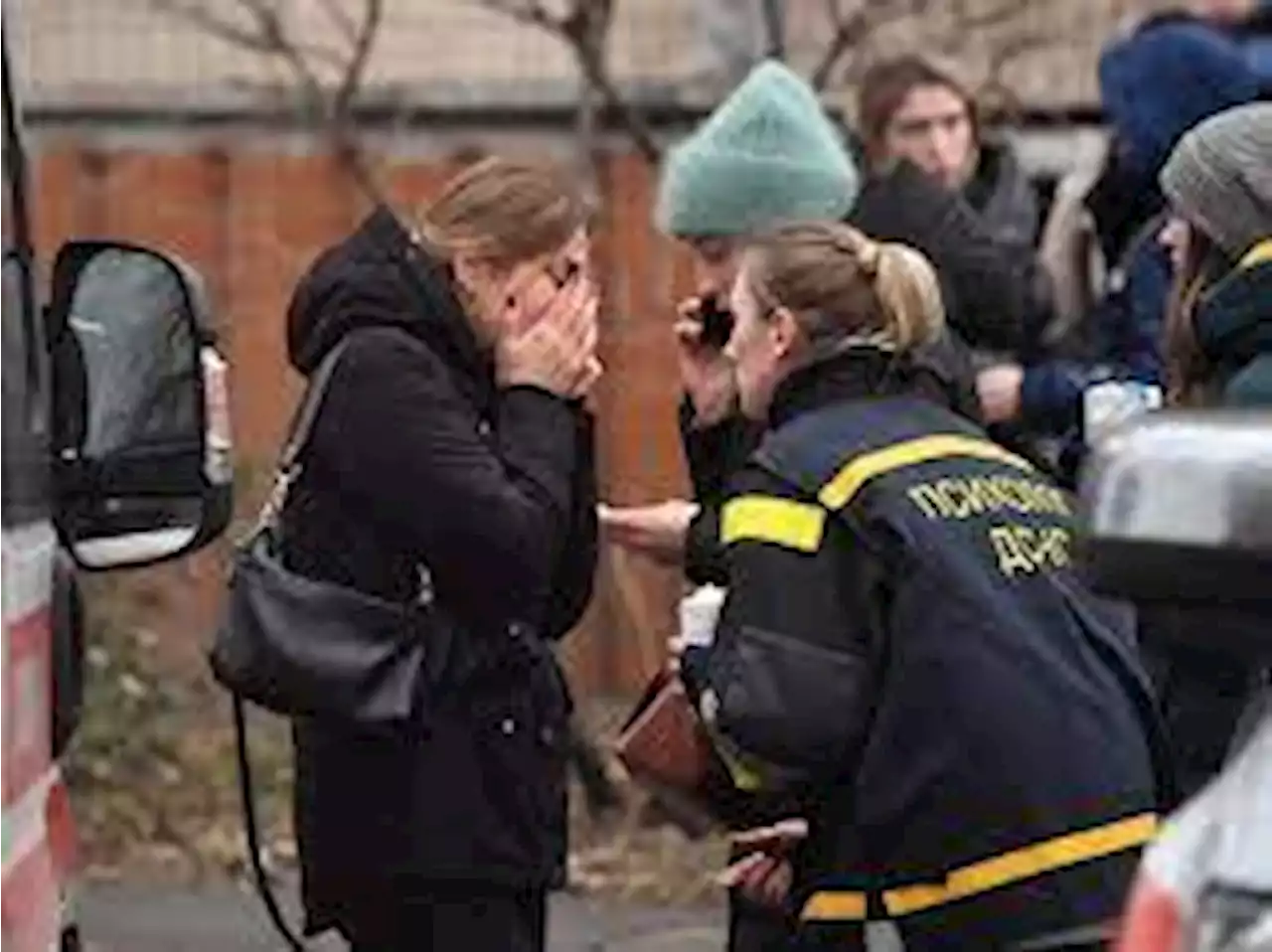 Body bags, blood and shock at Ukraine helicopter crash site