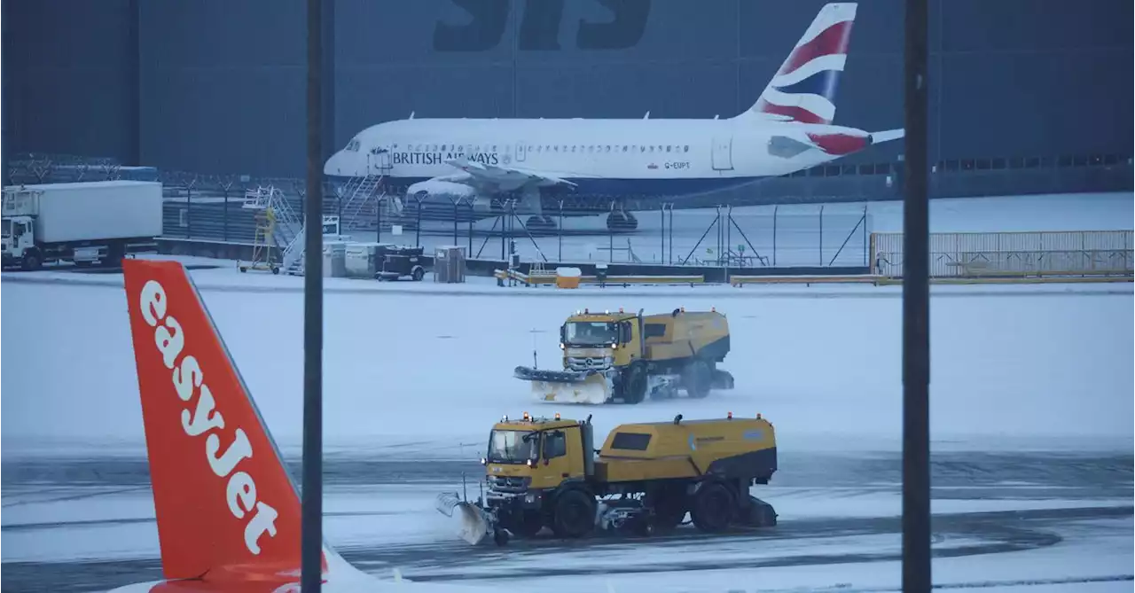 Heavy snow briefly closes runways at Britain's Manchester Airport