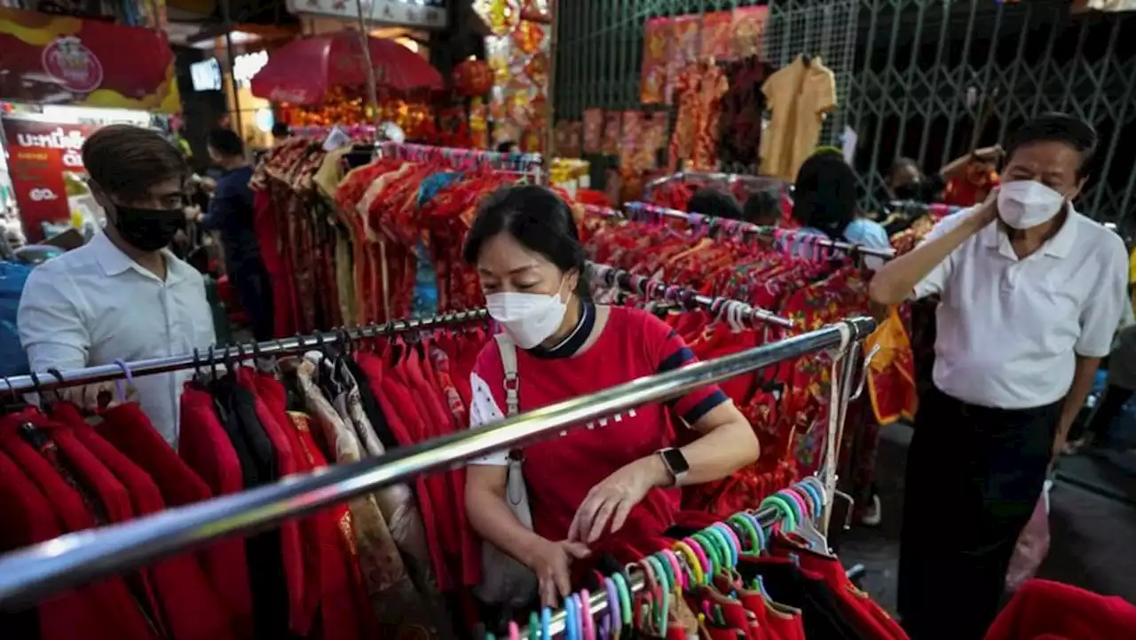 For Chinese Lunar New Year tourists, retailers roll out rabbit dances, red lanterns