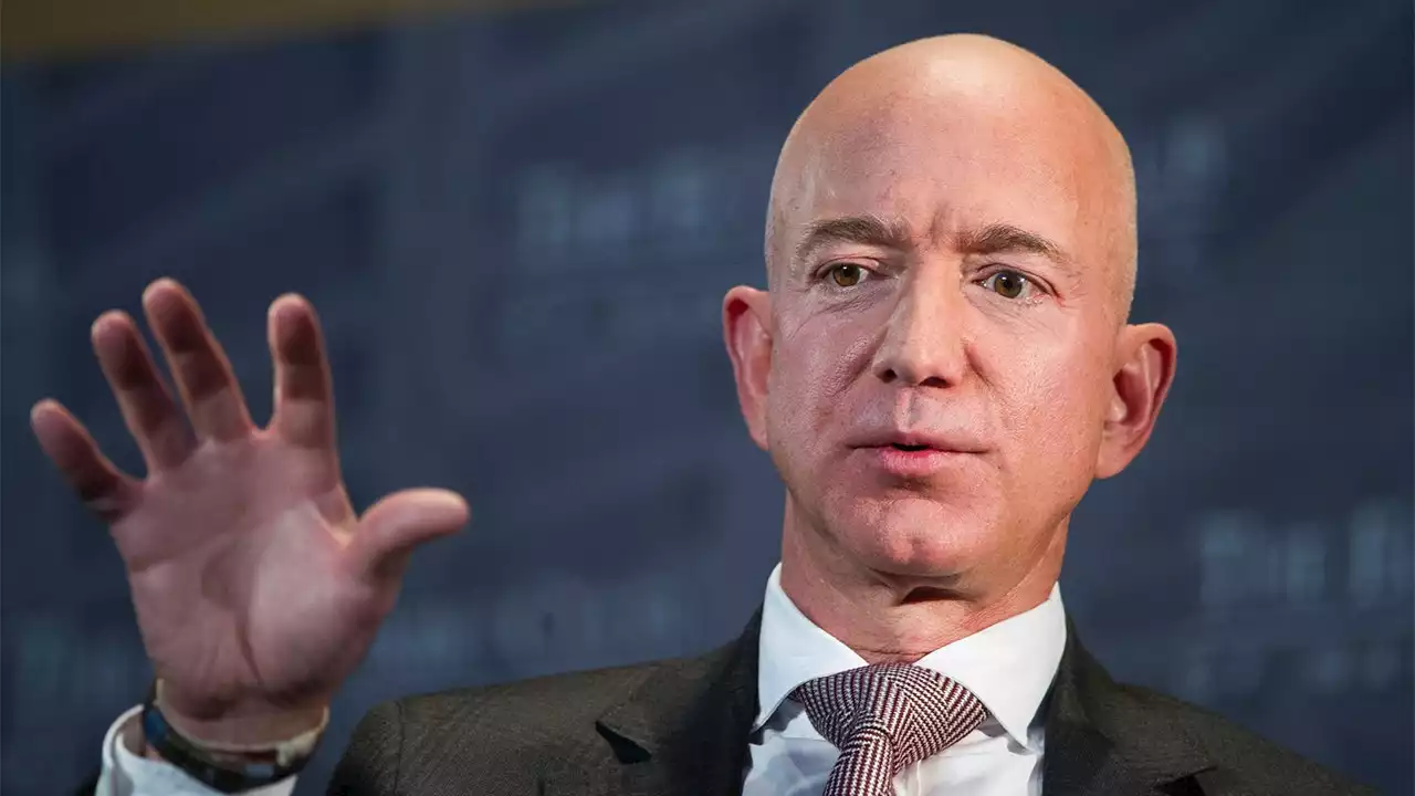 Jeff Bezos confronted by Washington Post employee over his newspaper's pending layoffs