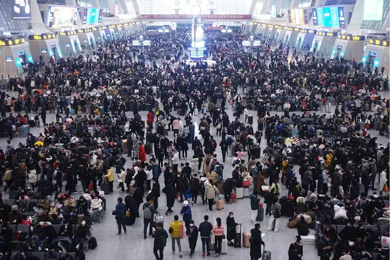 For Chinese Lunar New Year tourists, retailers roll out rabbit dances, red lanterns