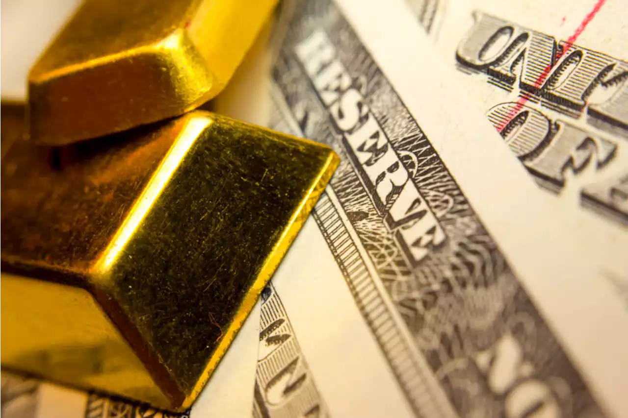 Gold price backs off on rising dollar, but set for fifth weekly rise