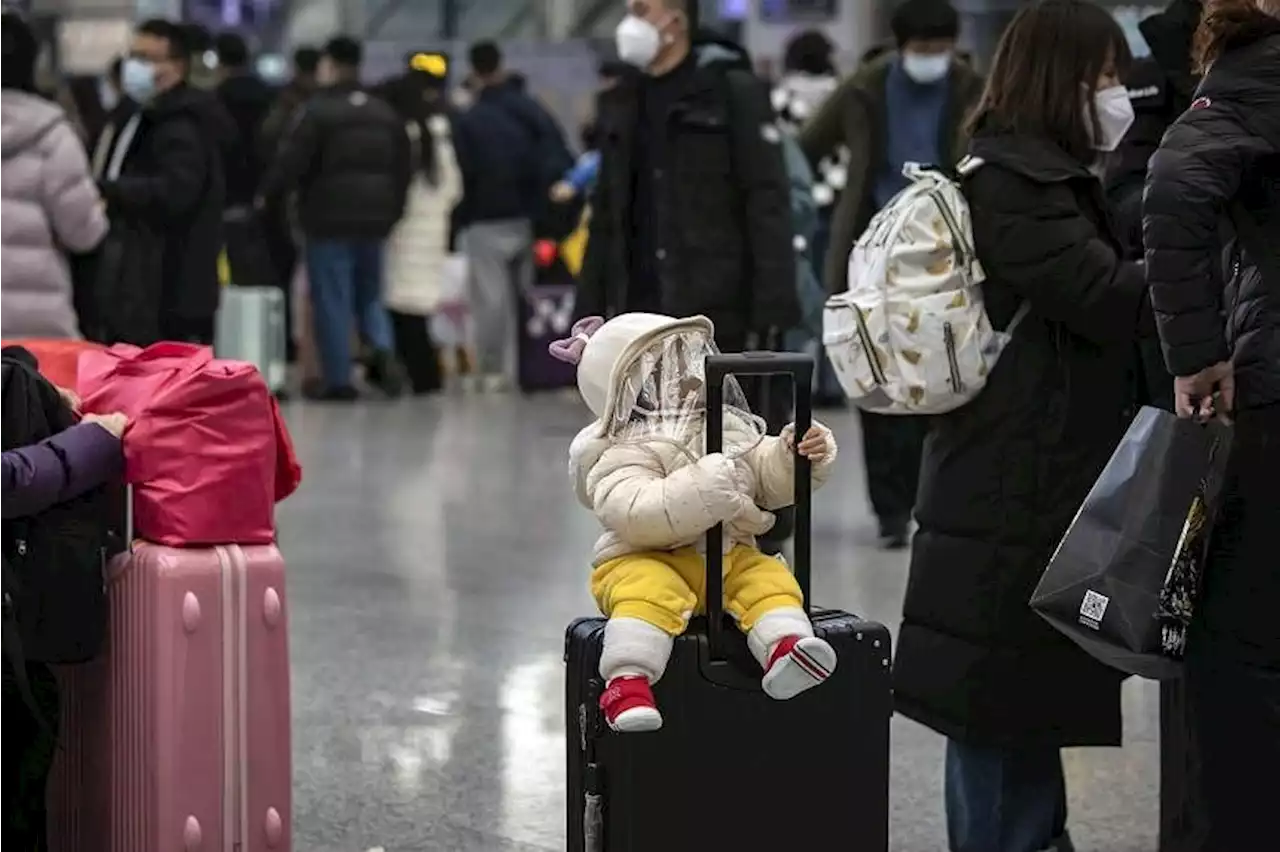 China says Covid-19 outbreak easing on eve of travel rush