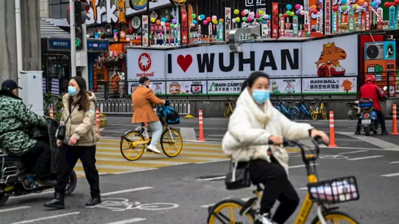 Bustling Wuhan markets celebrate Chinese New Year but grief remains