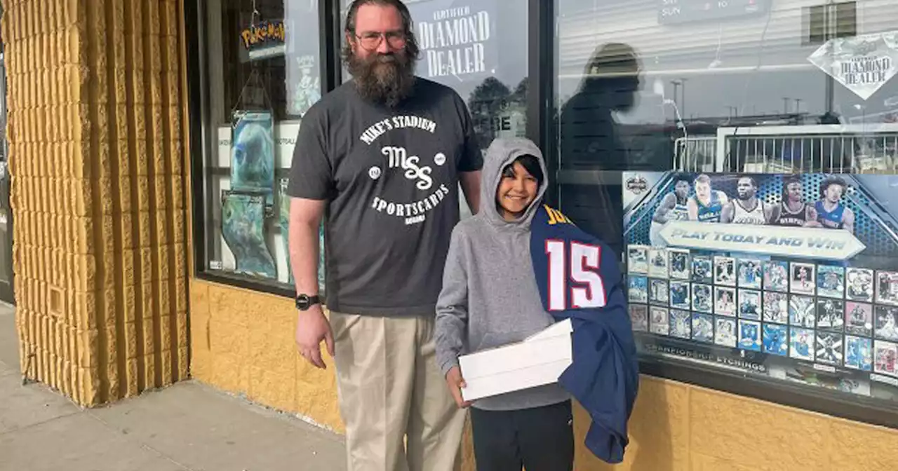 Sports card store owner surprises boy who lost card collection in Denver house fire