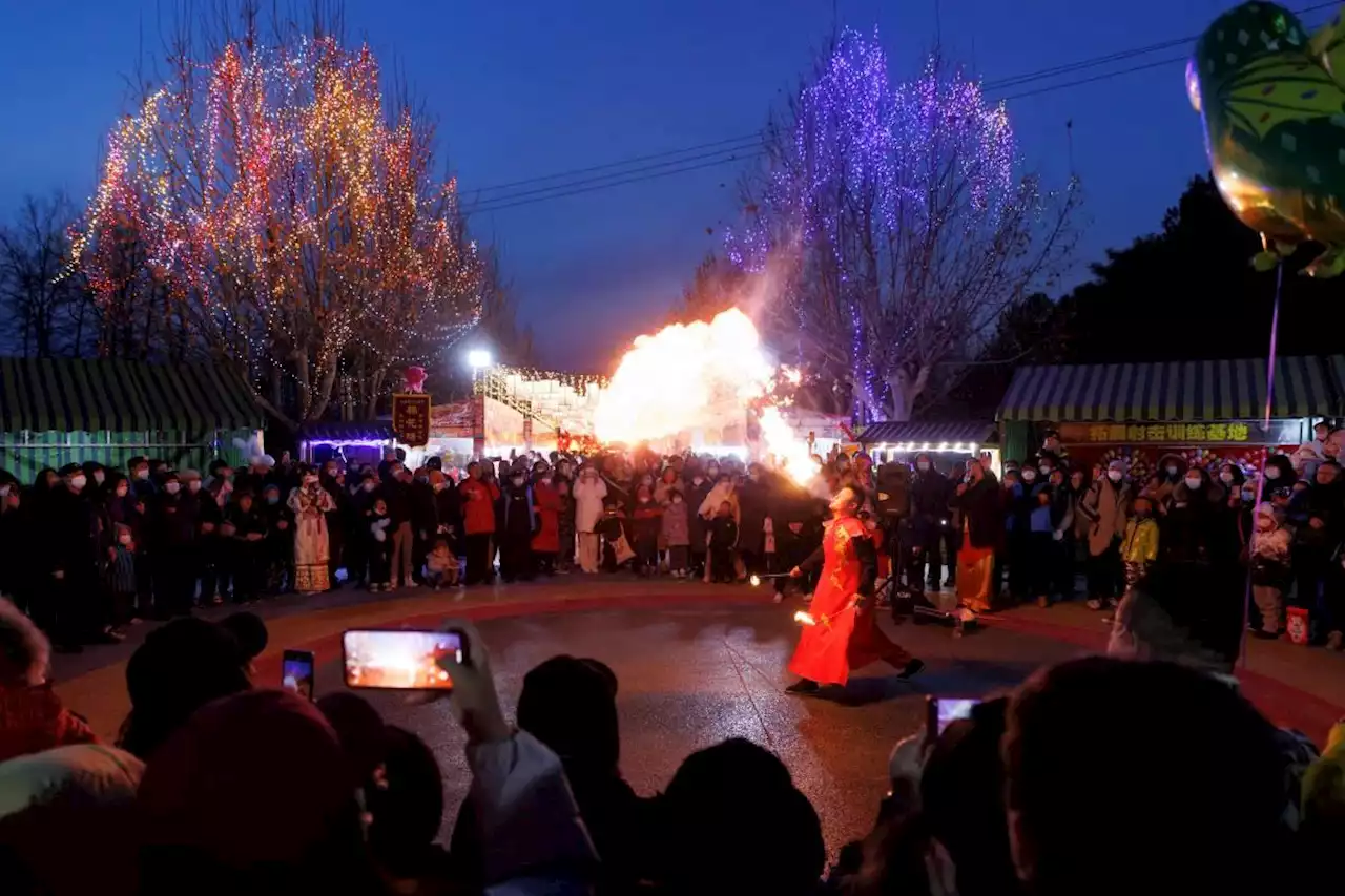 Chinese pray for health in Lunar New Year as COVID death toll rises