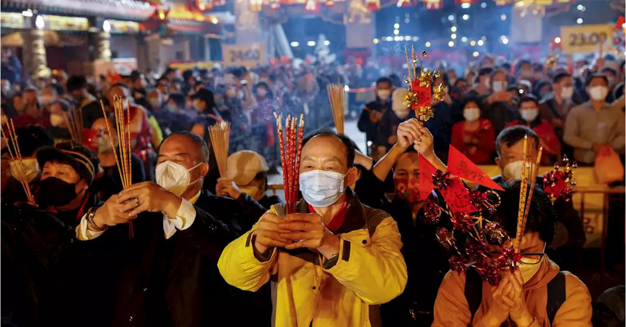 Chinese pray for health in Lunar New Year as COVID death toll rises