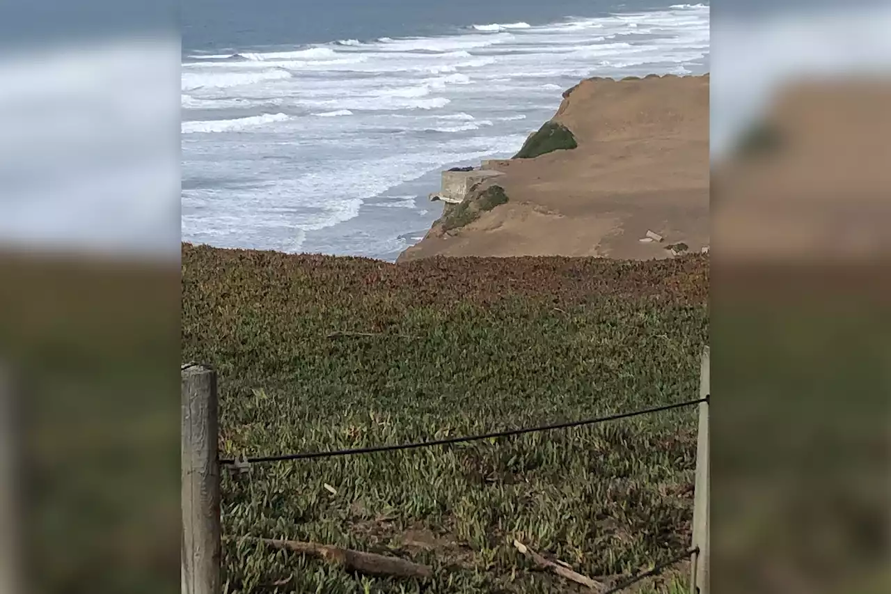 Photos shows WWII bunker on cliff's edge before it fell on SF beach