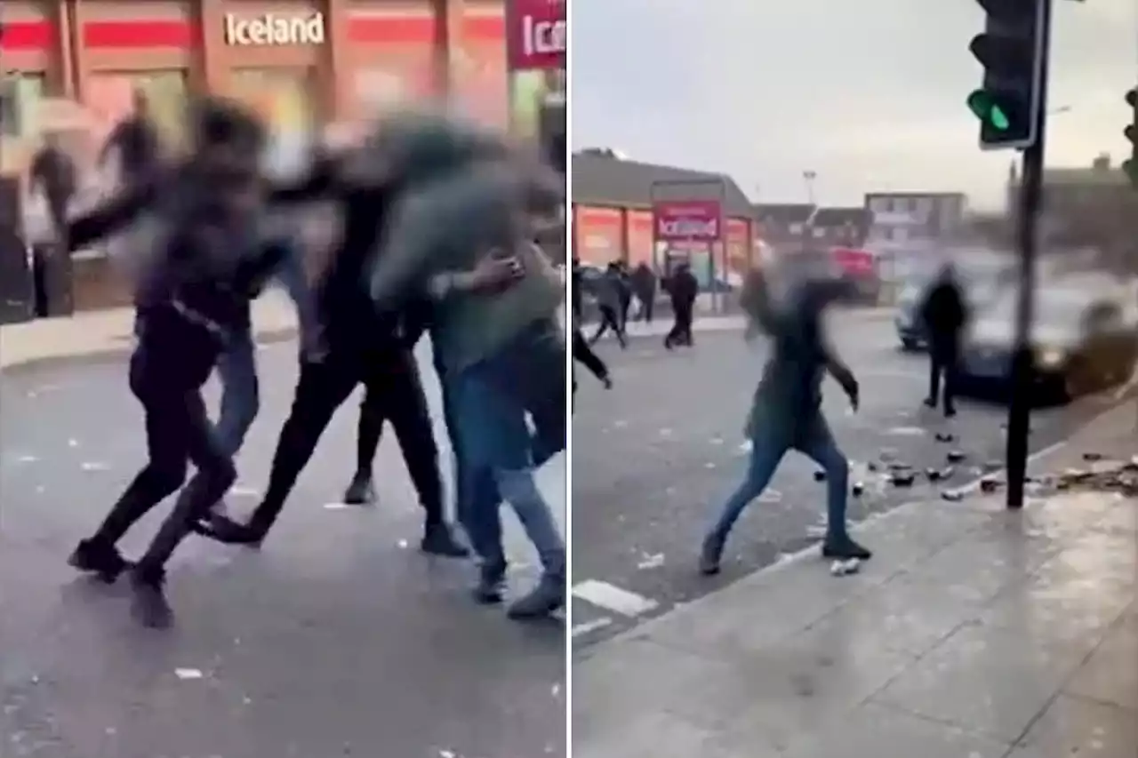 Shocking moment thugs brawl in the street, throw bottles and attack workers outside Wetherspoons pub