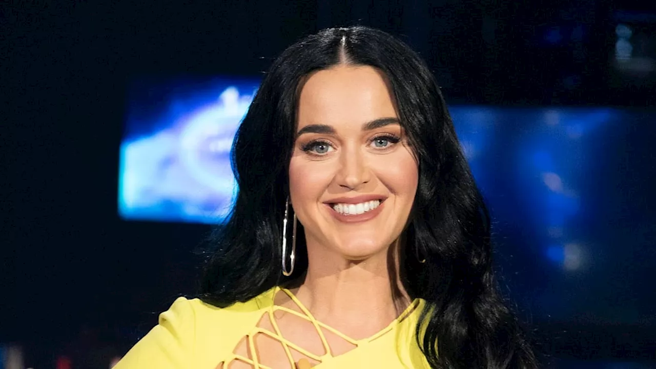 Katy Perry turns heads in a graphic bodycon dress and knee-high sparkly boots