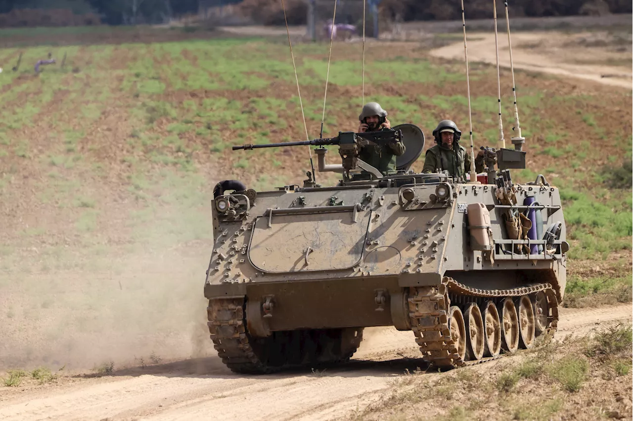 Israel-Hamas war updates: Troops mass at Gaza border; Hezbollah and Israel exchange shelling