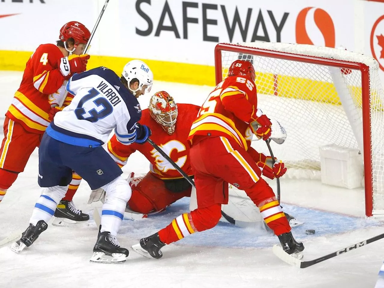 Flames score late winner, down Jets in season-opener