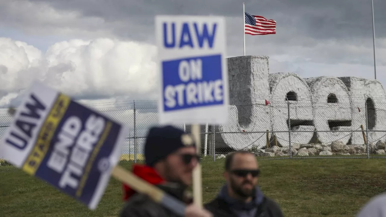 Auto workers escalate strike, walking out at Ford's largest factory and threatening Stellantis