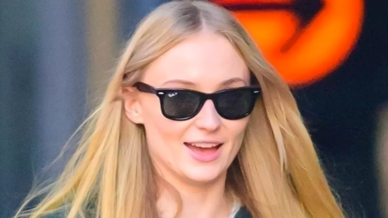 Sophie Turner looks jovial as she steps out in NYC with her young daughters... after reaching...