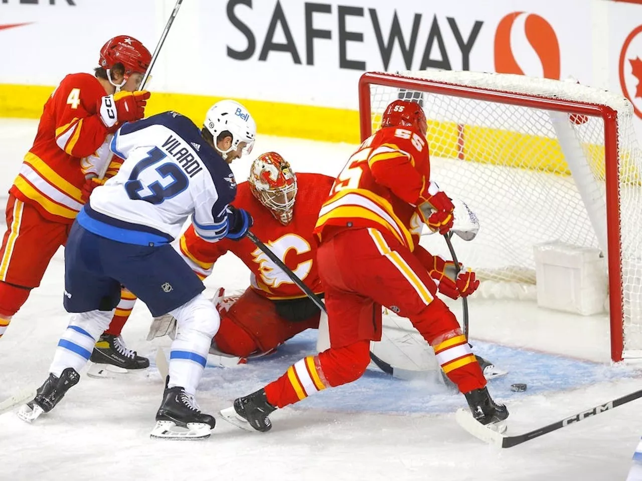 Flames use late surge to down Jets in season-opener