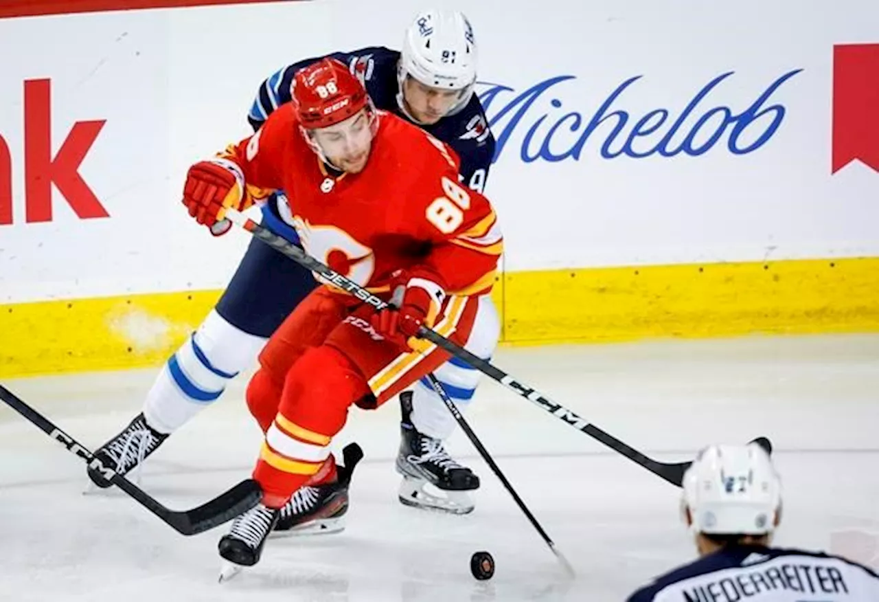 Mangiapane paces Calgary Flames to season-opening 5-3 win over Jets