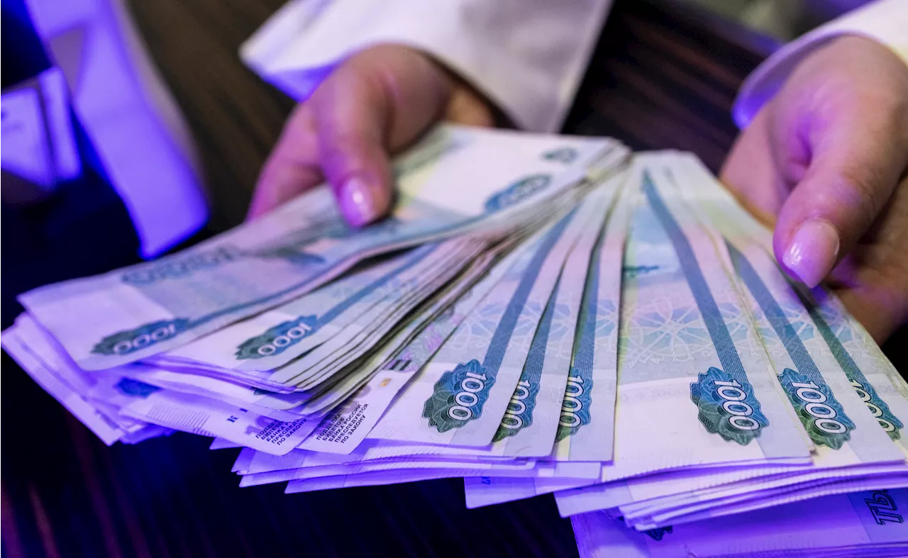 Rouble steadies, locking in gains made after Putin ordered capital controls