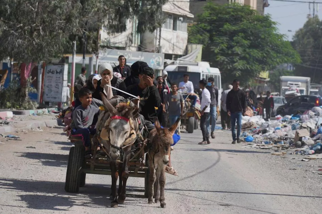 Palestinians flee as Israel orders evacuation and stages brief Gaza incursions