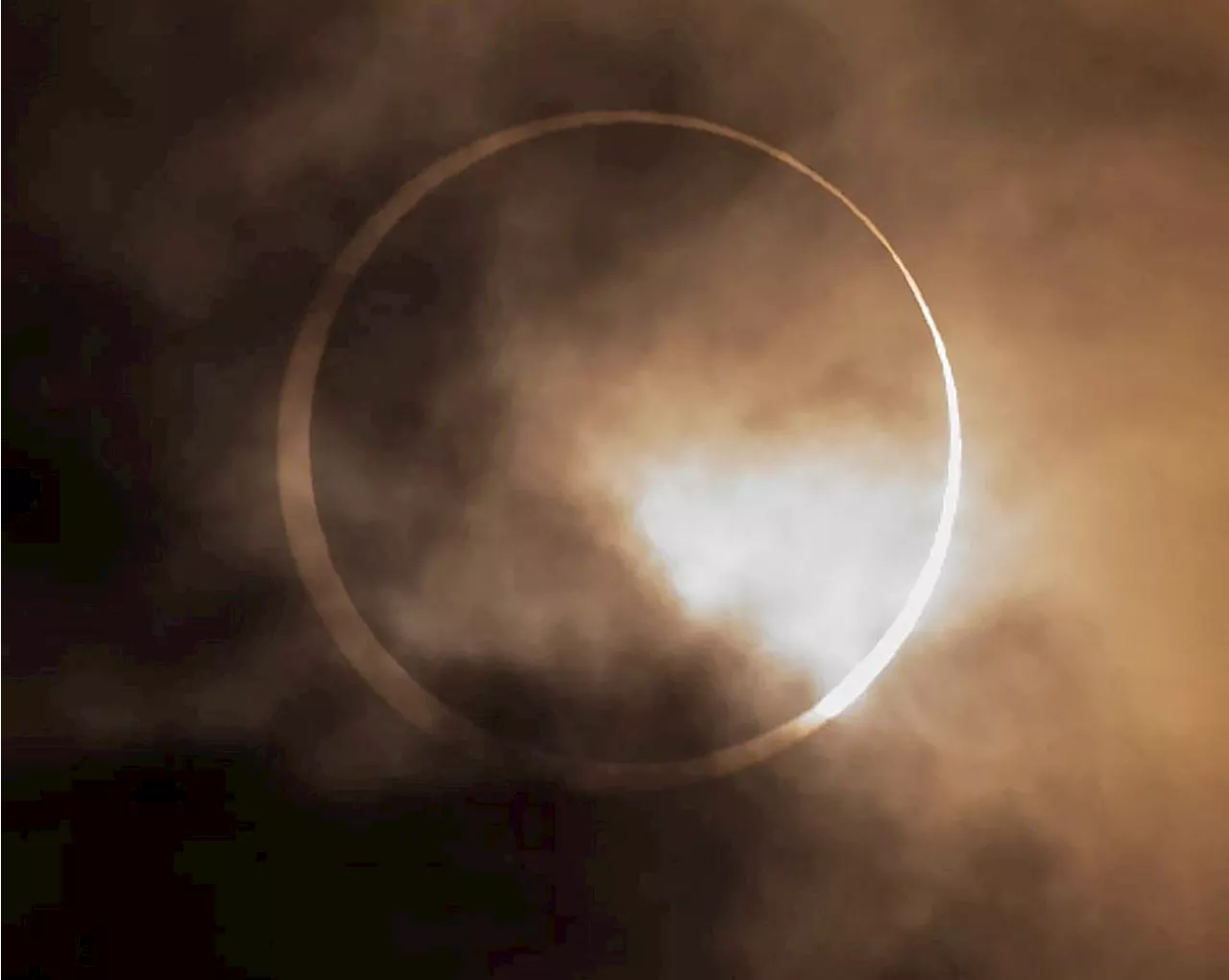 Brief cloud breaks bring cheers from excited partial solar eclipse watchers in B.C.