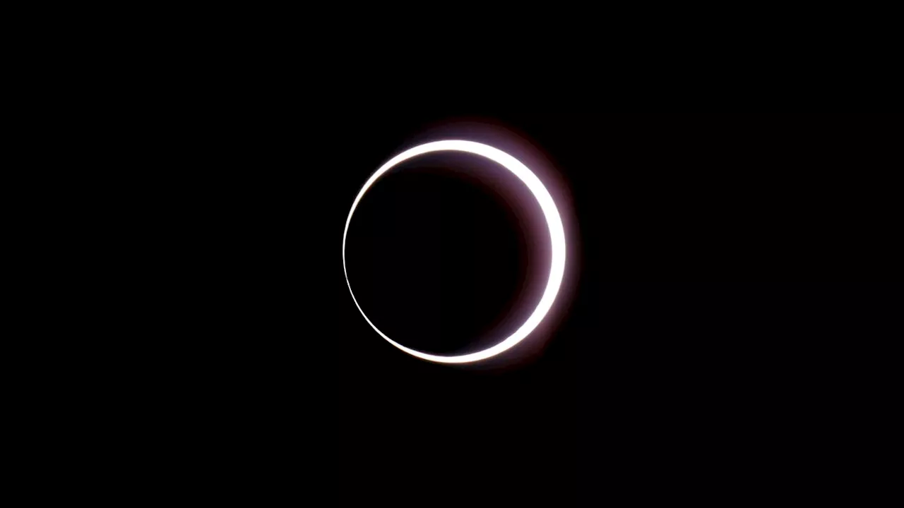 Crowds cheer as 'ring of fire' eclipse moves across the Americas, stretching from Oregon to Brazil