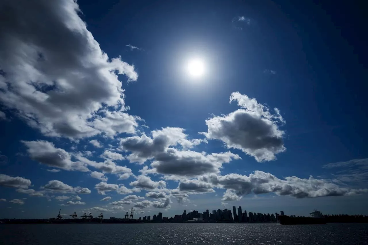 Brief cloud breaks bring cheers from excited partial solar eclipse watchers in B.C.