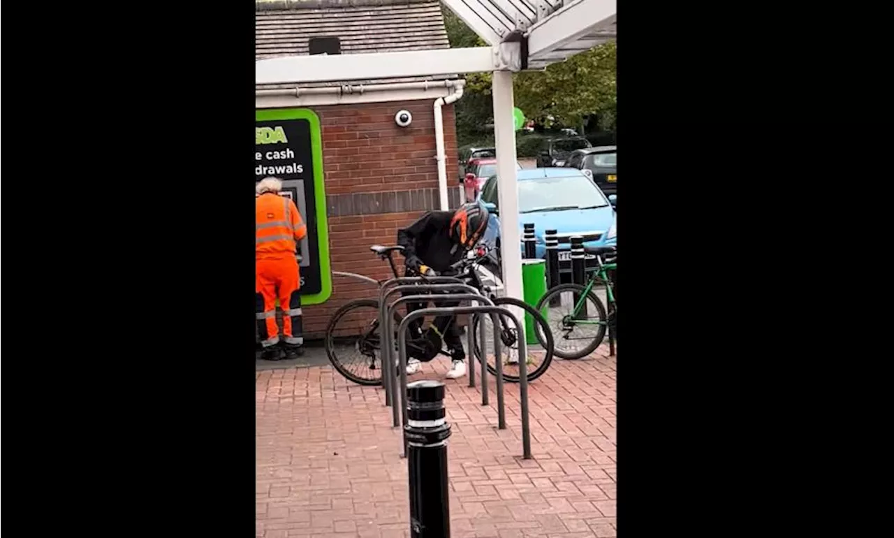 Britain’s bike theft scourge continues: Brazen thief attempts to steal bike outside Asda in broad daylight – as bystander withdraws cash