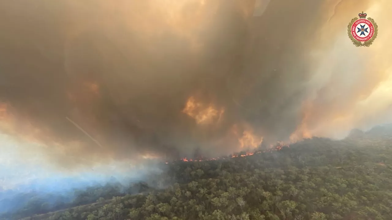 Fire bans in place for 11 southern Queensland council areas as bushfires threaten central parts of state