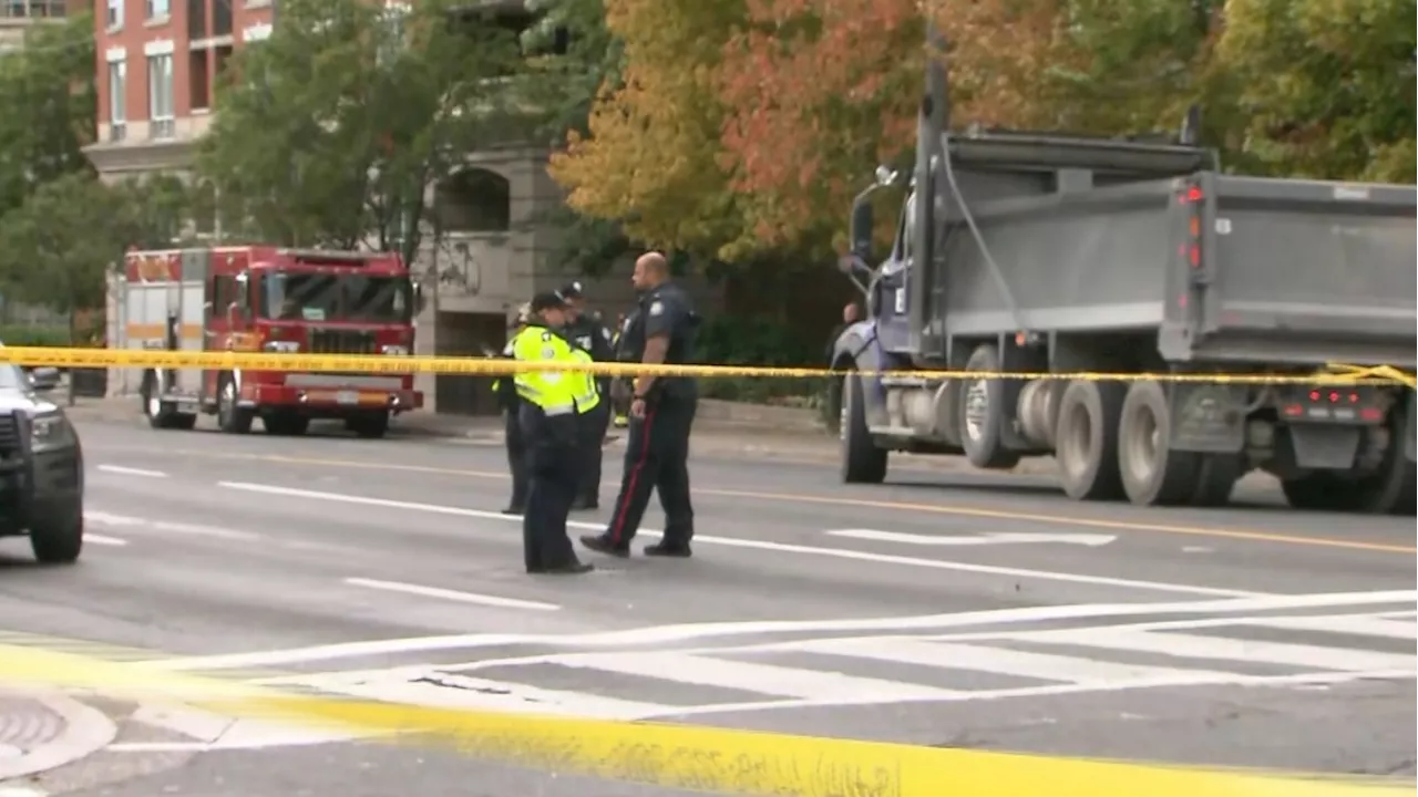 Woman dies after being struck by dump truck in midtown Toronto