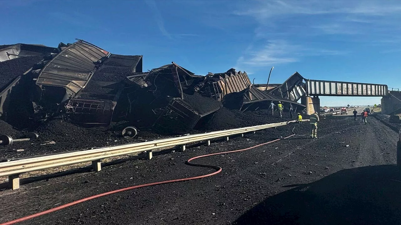 Semitruck driver dies in Colorado after train derails, spilling cars and coal onto highway