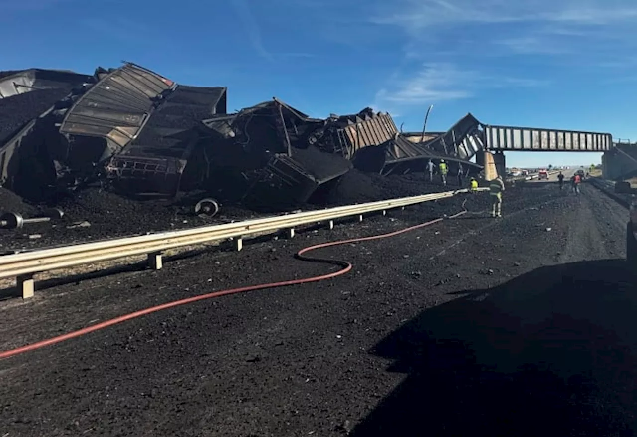 Semitruck driver killed when Colorado train derails, spilling train cars and coal onto a highway