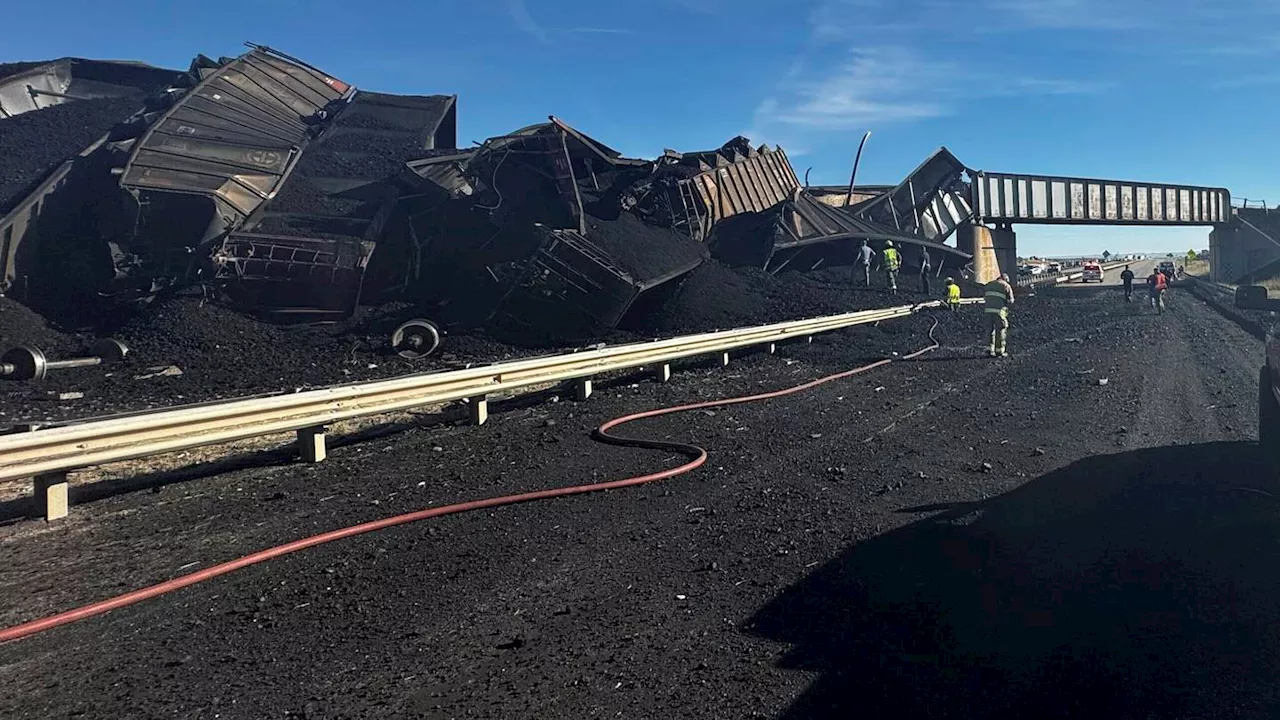 Semi-truck driver killed when Colorado train derails, spilling train cars and coal onto a highway