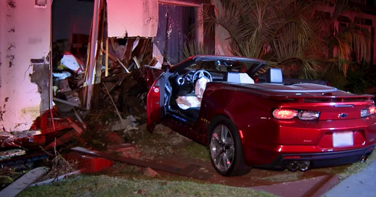 Driver arrested after convertible crashes into Ocean Beach home